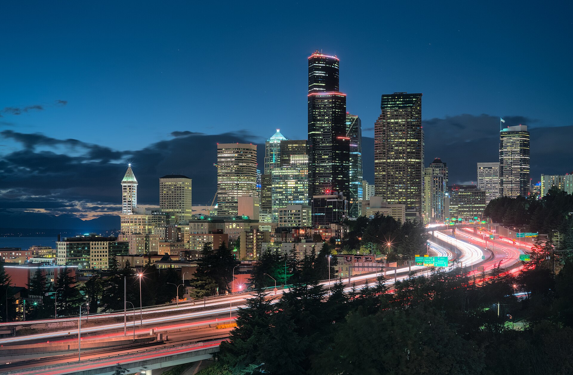 Seattle skyline at dusk with light trails on Interstate 5